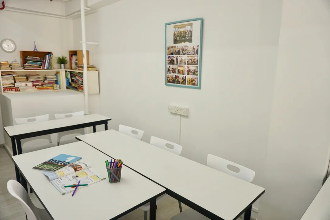 Spanish Studio small classroom with tables and learning materials